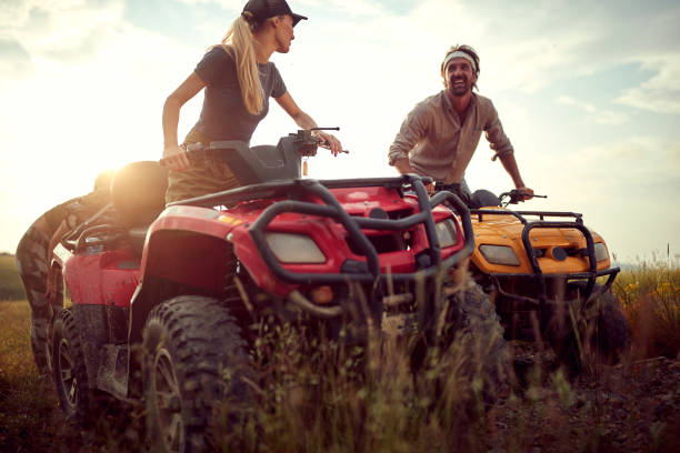 istock Two good friends driving quads together; Active vacation concept 1394155924