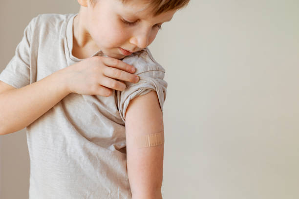istock Little child after vaccination with adhesive plaster 1394156960