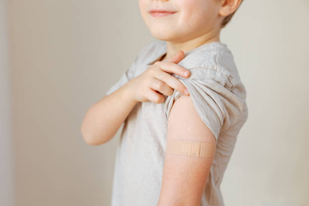 istock Little child after vaccination with adhesive plaster 1394157123