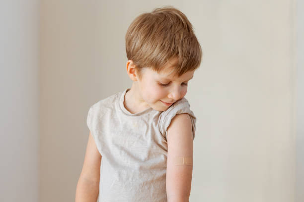 istock Little child after vaccination with adhesive plaster 1394157172