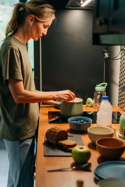 istock Young woman cooking in the kitchen 1394158304