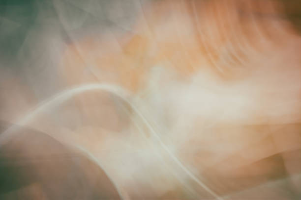 Gray orange wavy abstract background. Dirty shades. Light curved lines. Backdrop
