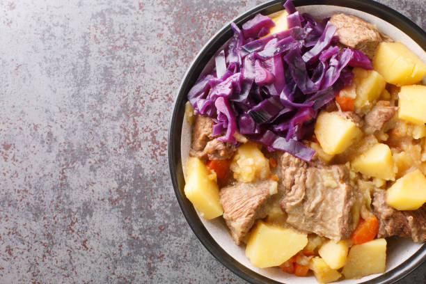 Scouse meat and potato stew from Liverpool close-up in a plate. Horizontal top view Scouse meat and potato stew from Liverpool close-up in a plate on the table. Horizontal top view from above pickled turnip stock pictures, royalty-free photos & images