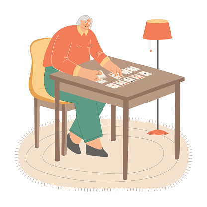 Elderly woman playing cards seated on a yellow chair at the table. Cartoon vector illustration.