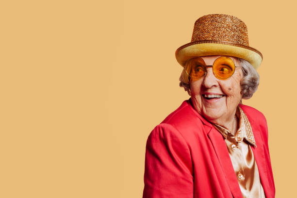 istock Cheerful stylish old grandmother studio portrait 1394161857