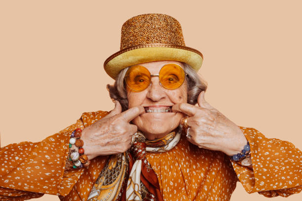 istock Elderly stylish grandmother doing funny face at studio 1394161865
