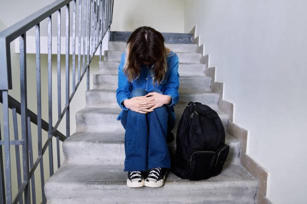 istock Sad frustrated young woman sitting on the steps 1394163433