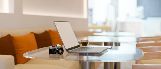 istock Modern cafeteria interior design with comfy colourful sofa, laptop mockup 1394163706
