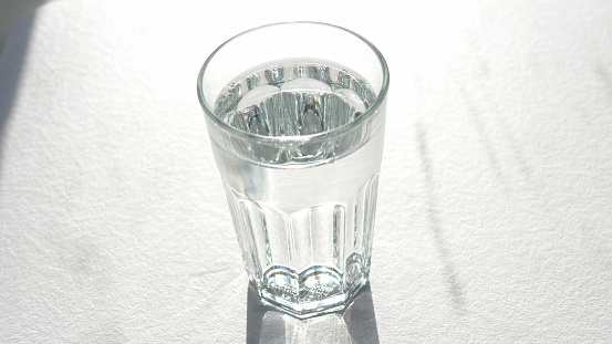 Glass of water standing on a table