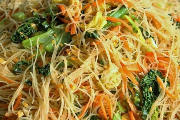 Stir fried rice noodles Full frame of stir fried rice noodles photo top view Rice Noodles stock pictures, royalty-free photos & images