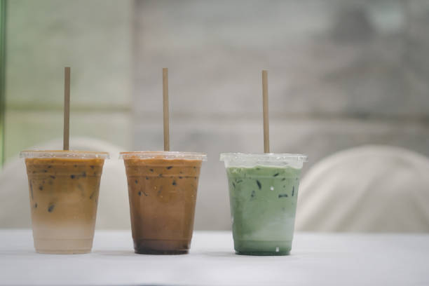 istock Iced green tea with a straw on the table. 1394174880