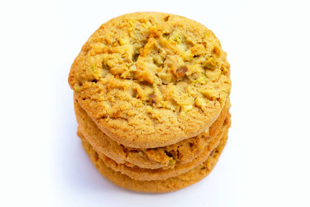 istock Pistachio and almond cookies on white background. 1394175487
