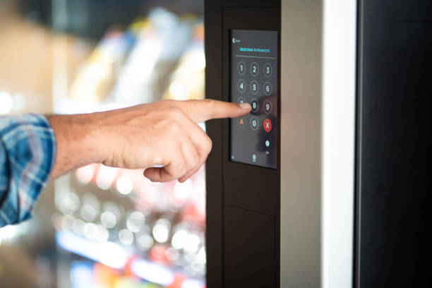 istock Cropped Hand Of Man Touching Vending Machine 1394180825
