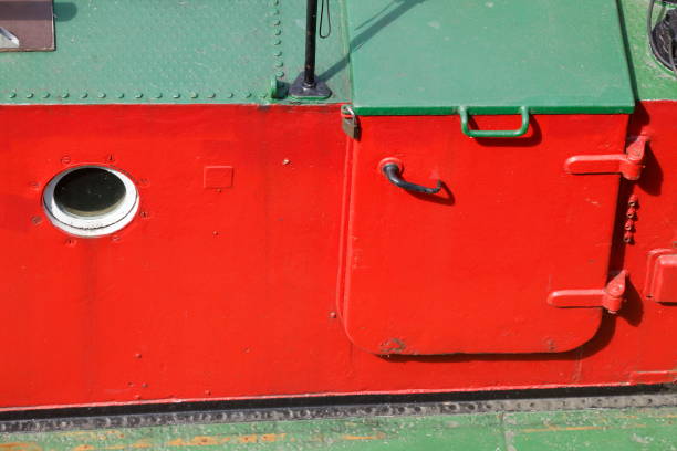 istock Red ship wall with porthole, Germany, europe 1394183216