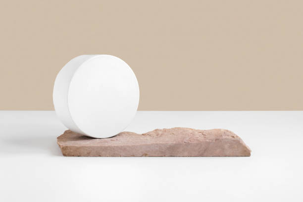 Podium for cosmetic product presentation. Abstract minimal geometrical form on white background. Oval stone form, shadow. Scene, Showcase, display. Minimal design. Trendy sunlight. Front view, Top View. podio para la presentación de productos cosméticos. forma geométrica mínima abstracta sobre fondo blanco. forma de piedra ovalada, sombra. escena, escaparate, pantalla. diseño minimalista. luz solar de moda. vista frontal, vista superior