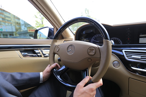 Kyiv, Ukraine - 26 april, 2017: Man driving luxury car Mercedes-Benz S class