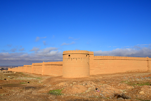 Kholm / Khulm / Tashqurghan, Balkh province, Afghanistan: tower and adobe walls of the Bagh-e Jahan Nama Palace enclosure, built in the Indian colonial style in the late 19th century by Emir Abdul Rahman Khan, (the 'Iron Amir'). During his 21 year rule, he kept the country from becoming occupied by British India or Russia.