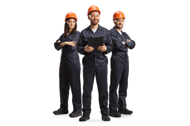 Factory workers in uniforms wearing helmets and goggles Factory workers in uniforms wearing helmets and goggles isolated on white background car portrait men expertise stock pictures, royalty-free photos & images