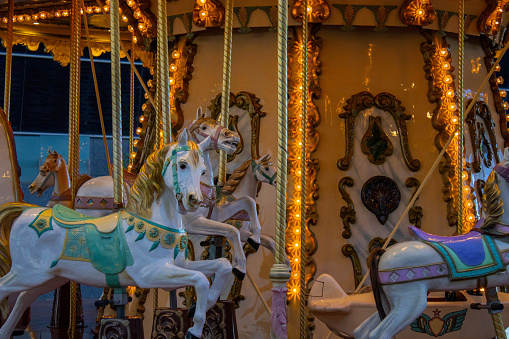 Carousel for kids with lights on in Barcelona