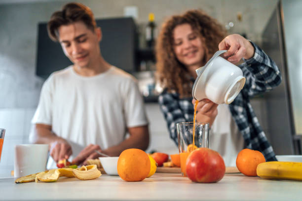 istock Couple making fresh healthy breakfast 1394199449