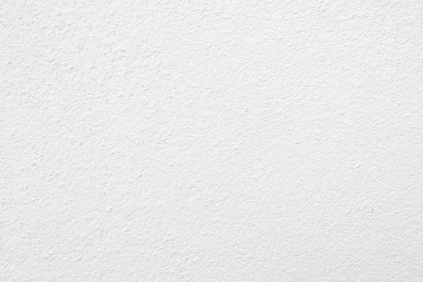 istock Seamless texture of white cement wall a rough surface, with space for text, for a background.. 1394199571