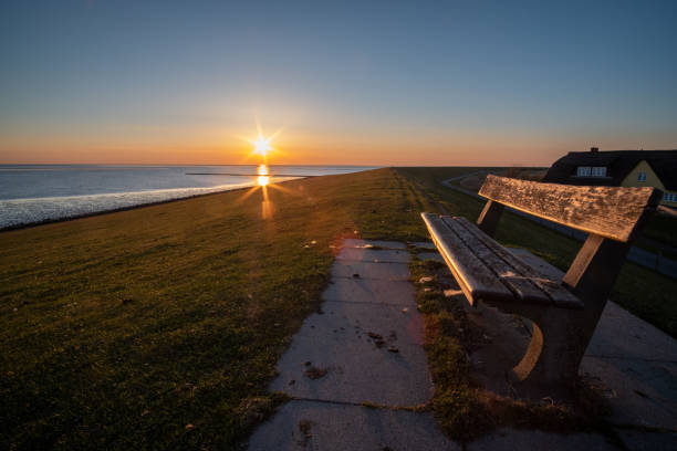 istock Sunset on the dike in waddensea 1394199575