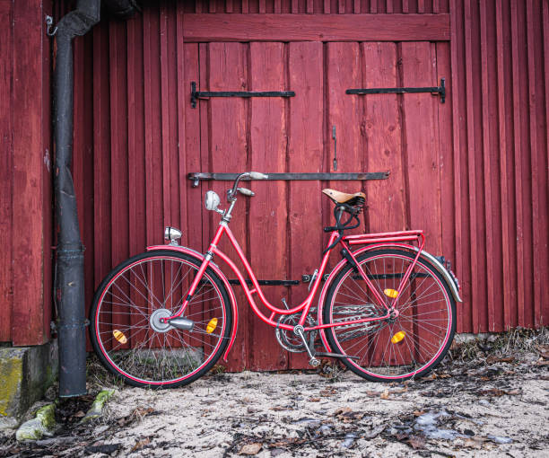 istock Red bike against red wall 1394199742