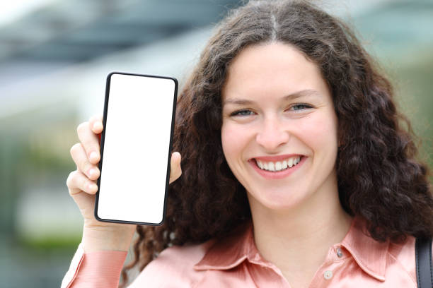 istock Happy woman with blouse showing blank phone screen 1394200503