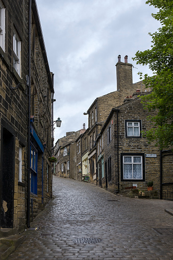Historic cobbled Main Street, Haworth, West Yorkshire, Engand, UK: home of the famous Brontë sisters, Haworth is an undisputed literary mecca, attracting visitors from all around the world.