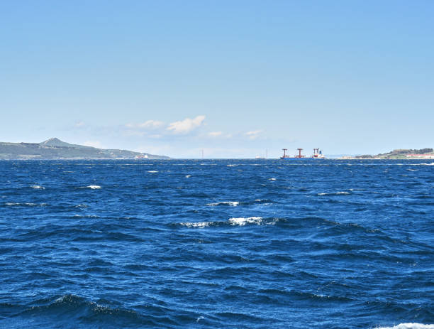 istock Cargo ship crossing the strait , 1915 Canakkale Bridge in background 1394203375