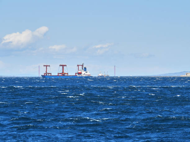 Cargo ship crossing the strait , 1915 Canakkale Bridge in background