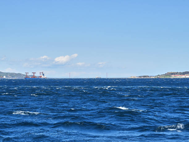 istock Cargo ship crossing the strait , 1915 Canakkale Bridge in background 1394207556