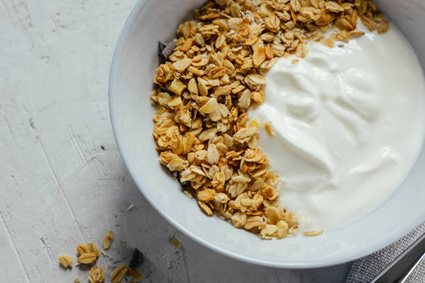 istock Yogurt with muesli and berries on a gray background. 1394209497