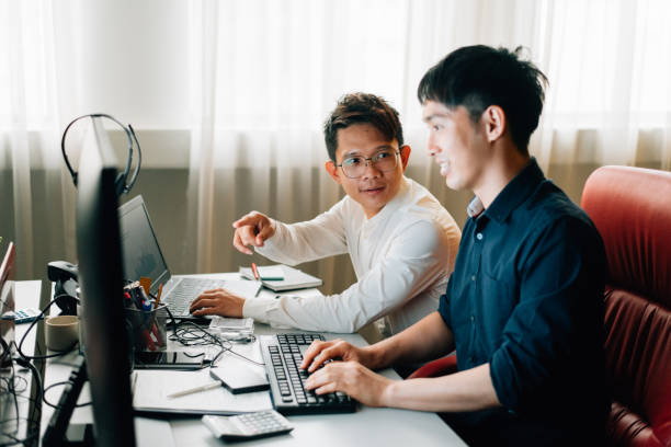 istock Businessmen working on computer in the office 1394209504