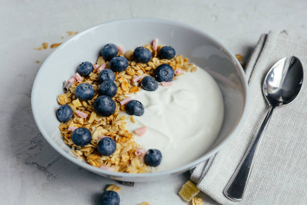istock Yogurt with muesli and berries on a gray background. 1394209823
