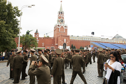 Moscow - Russia, May 28th 2017: large group of army soldiers walking in front of Kremlin and Red Square.