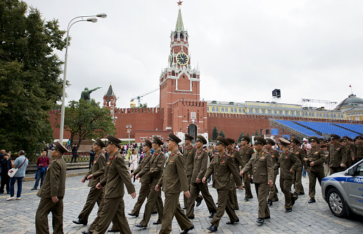 Moscow - Russia, May 28th 2017: large group of army soldiers walking in front of Kremlin and Red Square.