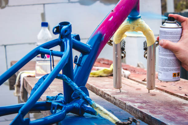 istock father paints a bicycle for a child. 1394215862