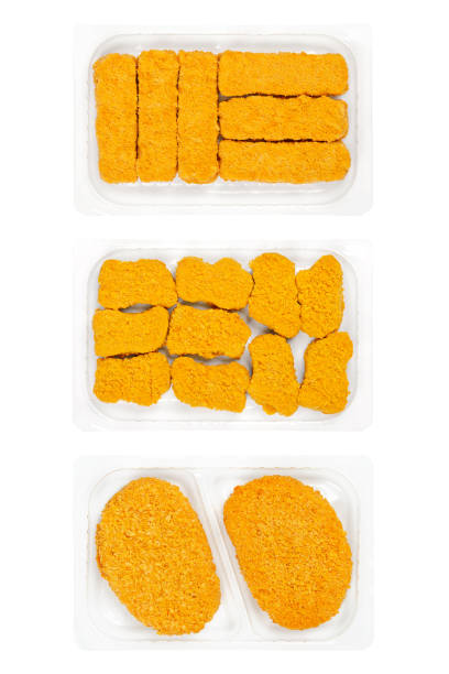 Vegan breaded sticks, nuggets and cutlets, in clear plastic trays. Vegan fish fingers, nuggets and slices of schnitzel, based on soy and wheat protein, a pre-fried meat substitute. Convenience food.