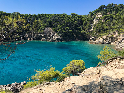 The bay of Cala Matano in the Tremiti islands in Italy. Bay with transparent blue sea in summer on a sunny day in Italy