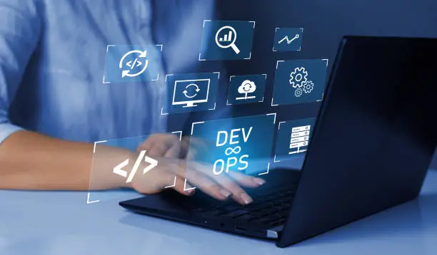 Agile programming and DevOps concept. Engineer working on laptop with virtual screen. IT operations, high software quality and software development