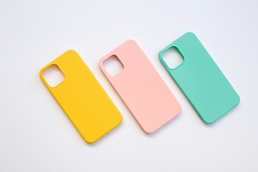 Cases set for smartphone on white background. Silicone protection for mobile phone. Colorful silicone phone cases.
