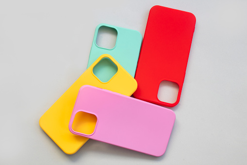 Cases set for smartphone on grey background. Silicone protection for mobile phone. Colorful silicone phone cases.