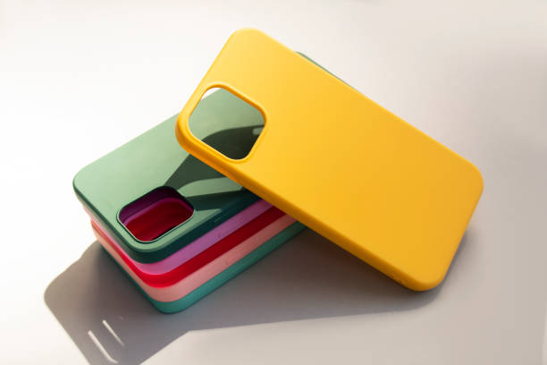 istock Cases set for smartphone on grey background. Silicone protection for mobile phone. Colorful silicone phone cases. 1394218599