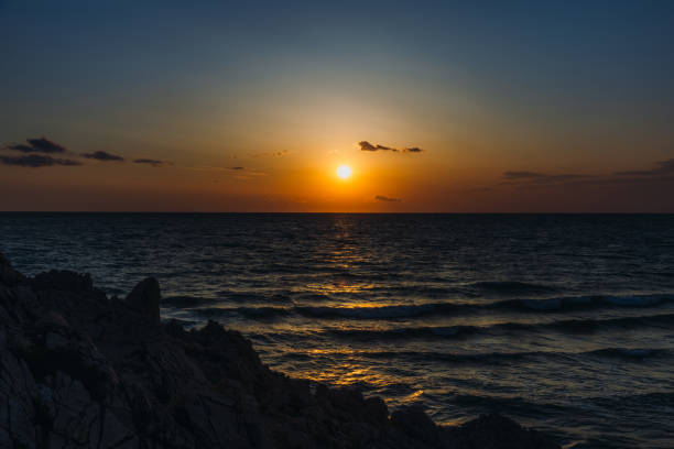 Dramatic view of the beautiful bright colorful sunset from above at Patara beach, South Turkey