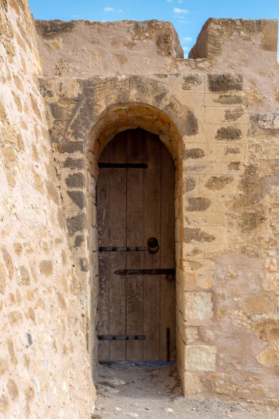 Door in an ancient, urban fortress in the city of Sitia on a sunny day (island Crete, Greece)