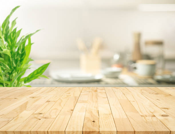 istock Selective focus.Wood table top on blur kitchen counter background. 1394223472