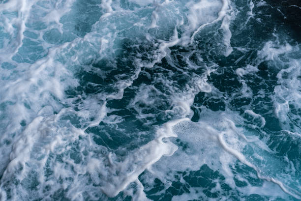 istock Sea water waves and white foam. 1394225267