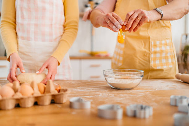 istock Mother And Daughter Baking In The Kitchen 1394227905