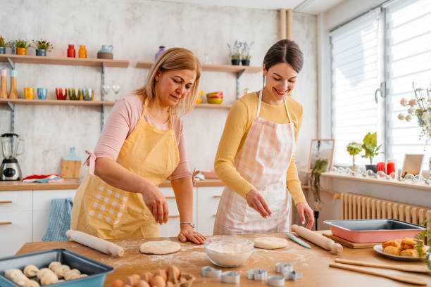 istock Mother And Daughter Baking In The Kitchen 1394228150